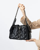 Cowhide Black quilted handbag with chain detail 