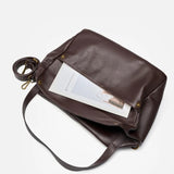 Coffee leather handbag with a strap 