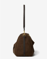 Brown handbag with a black handle on a white background